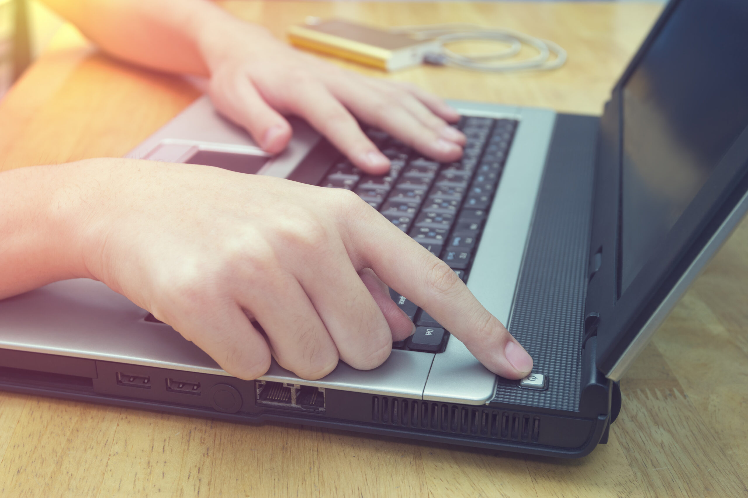 Turn,On,The,Switch,Laptop,On,Desk,closeup,Man,Using,Notebook